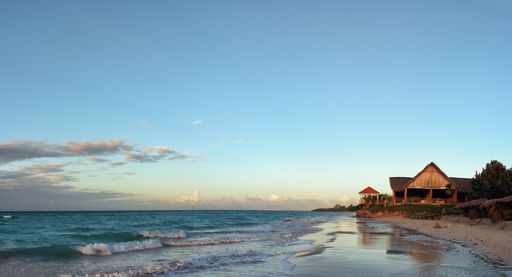 A closeup shot of the blue ocean and constructions on the seaside in Varadero, Cuba