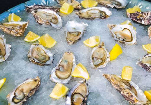 A high angle shot of gourmet oysters and lemon