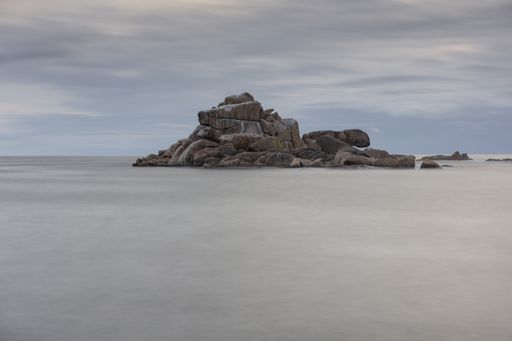 A beautiful scene of huge stacked stones on Falcoeiro islet, Galicia, Spain