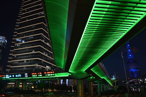 The underside of a bride lit by neon green lights in Shanghai, China at night