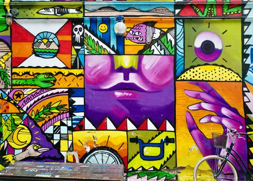 A beautiful wall covered in colorful graffiti Hackesche Hoefe, Berlin