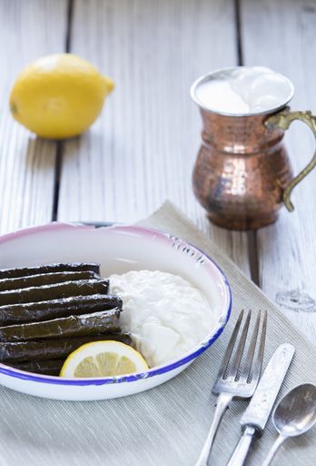 A vertical shot of  rice and mint wrapped in grapevine leaves