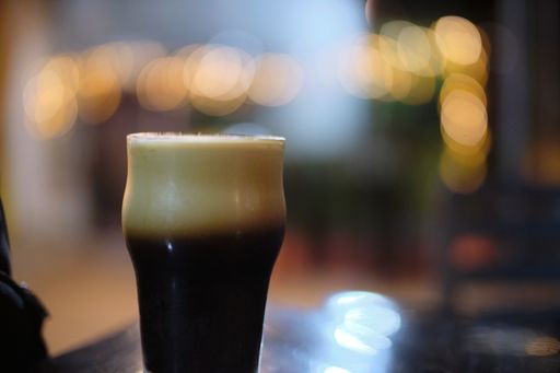 A selective focus shot of fresh delicious americano in a glass