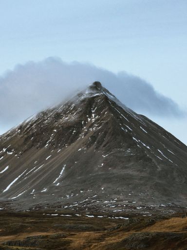 Majestic mountain and dense cloud covering its summit, Iceland