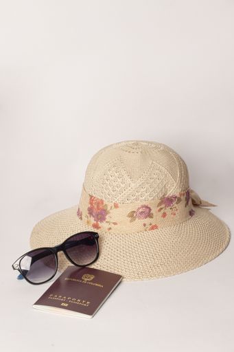 A vertical shot of sunglasses, passport, and hat isolated on white background - travel concept