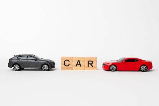 CAR wooden text with red sedan and black SUV cars with copy space on white background