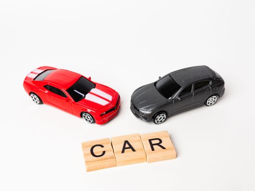 CAR wooden text with red sedan and black SUV cars with copy space on white background