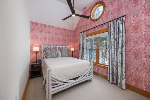 A beautiful modern bedroom interior design. Custom-built house in the mountains.