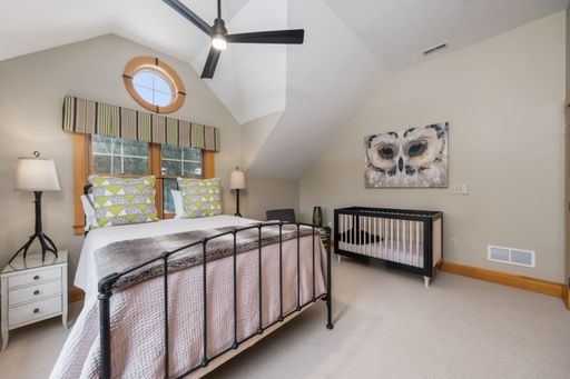 A beautiful modern bedroom interior design. Custom-built house in the mountains.