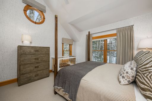 A beautiful modern bedroom interior design. Custom-built house in the mountains.