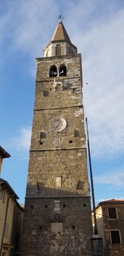 A low angle view of church building tower in Buje