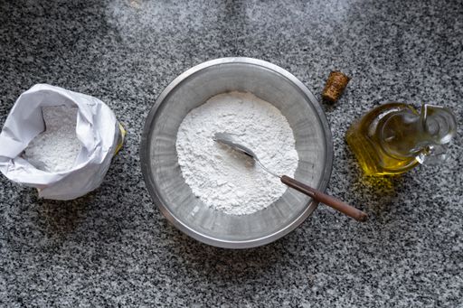 An overhead shot of ingredients for cooking on a marble table