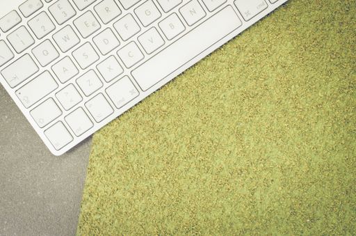 A top view of a computer keyboard on an office desk with copy space