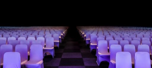 An empty conference center with a lot of empty chairs