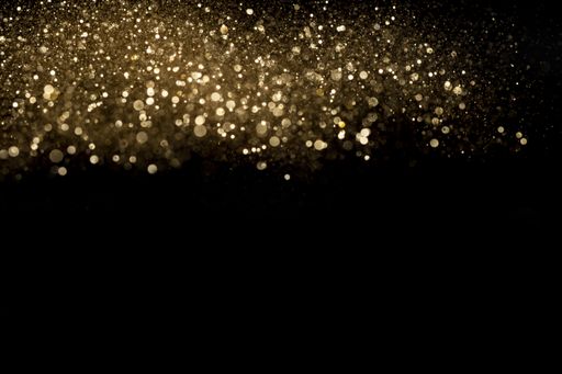 A closeup shot of beautiful golden glitter for wallpaper or background