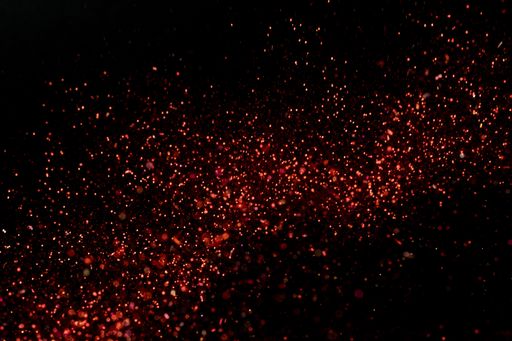 A closeup shot of beautiful red glitter for wallpaper or background