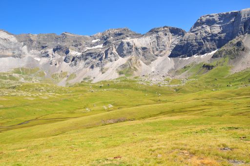 The beautiful green valley with rocky mountains. Pyrenees National Park, France.
