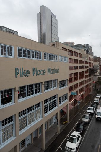 A vertical shot of Pike Place Market and its parking on a cloudy day