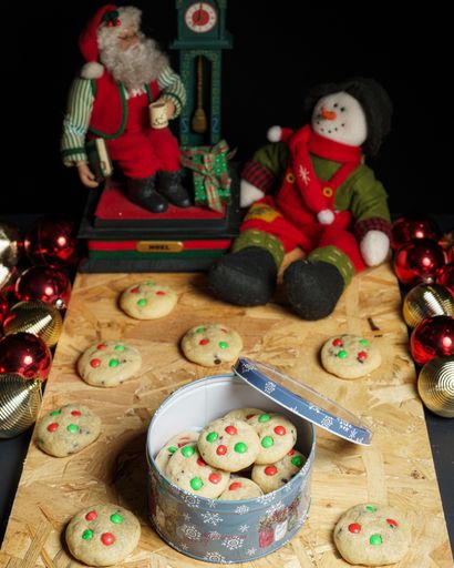 A vertical shot of Christmas decorations and cookies