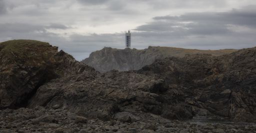 Mighty cliffs of Valdovino and Punta Frouxeira lighthouse during a cloudy day in Galicia, Spain