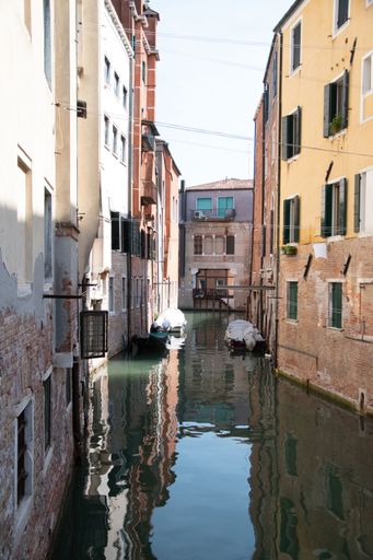 An outdoor view of residential buildings and the famous canal in Venice, Italy