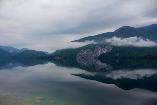 A beautiful mountain lake Wolfgangsee with mountains on a gloomy day