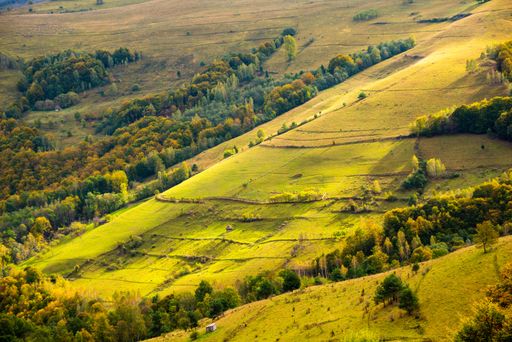 A beautiful landscape with the famous Apuseni Mountains range in Romania under a cloudy sky