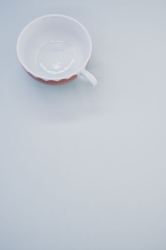 A vertical shot of cup isolated on white background