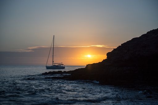 A beautiful shot of a boat at sunset in the Atlantic Sea on the Island of Fuerteventura in Spain