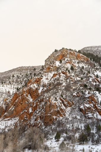 A snow-covered mountain in Utah on a clouded day