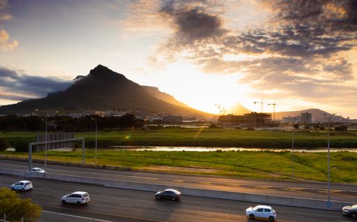 Cape Town, South Africa - October 12, 2022: Rush hour traffic on motorway at sunset