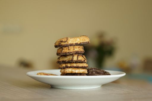 A white plate with different shapes of cookies