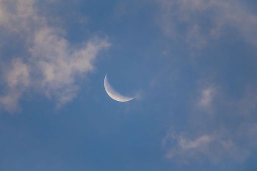 A beautiful view of crescent in cloudy sky