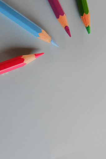 A top view of colored pencils isolated on a white surface