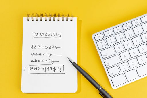 Change Weak to strong Password written on a notepad. Computer or network security concept. Top view