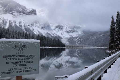 A sign board with Emerald Lake in the background. Yoho National Park, British Columbia, Canada.