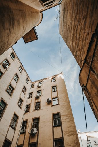 A vertical low angle shot of beautiful old stone buildings