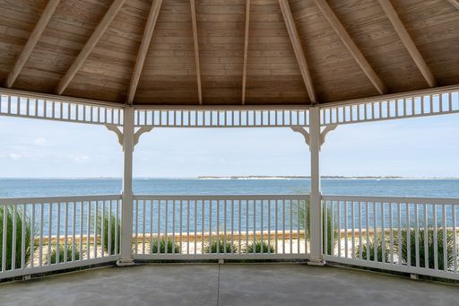 A gazebo with a beautiful view by the side of the ocean