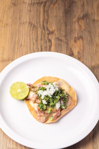 A top view of delicious and appetizing Mexican food on a wooden table