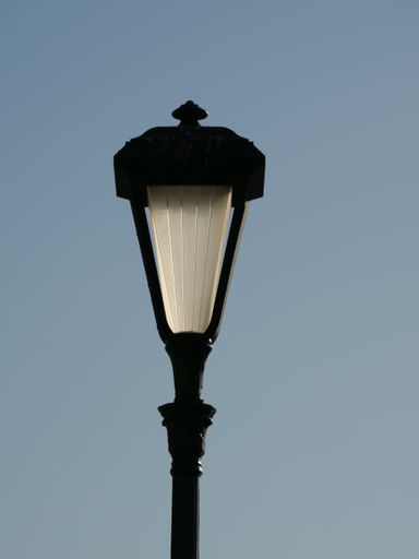 A vertical closeup shot of a vintage street lig