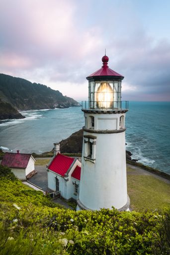 A lighthouse in Oregon on the sunset