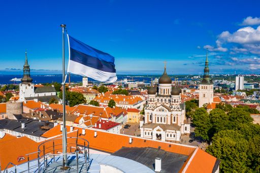 An aerial view of the Estonian flag waving on the Tall Hermann Tower ,Tallinn, Estonia