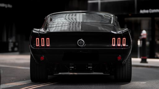 A rear view of the EV supercar, Mustang electric car in the financial district of London