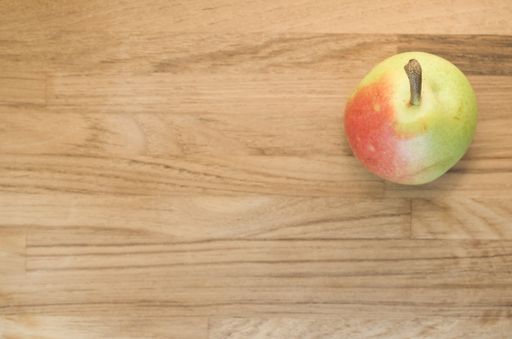 A top view of a pear on a wooden surface