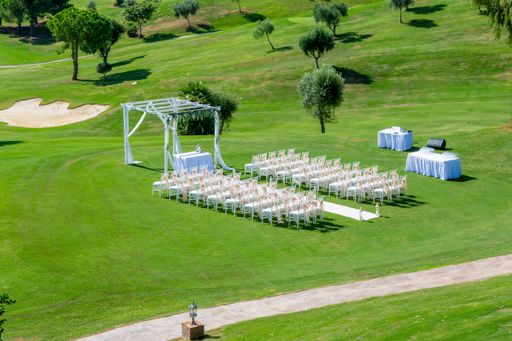 A high angle shot of a wedding set up in a field