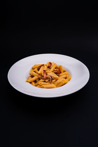 A closeup shot of a tasty looking spaghetti isolated on a black background