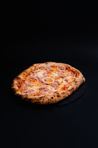 A closeup shot of a tasty looking pizza isolated on a black background