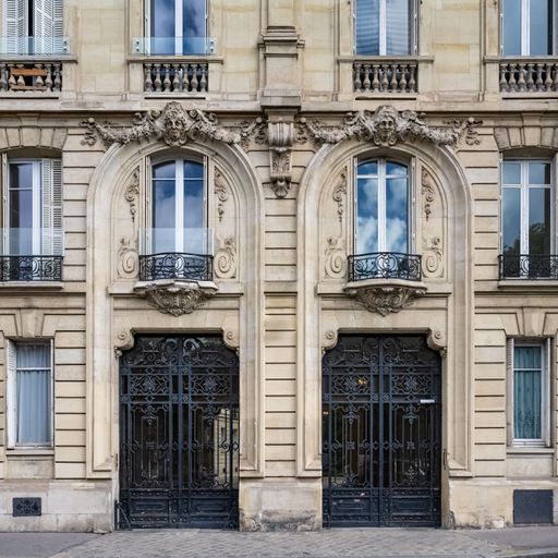 Paris, two ancient wooden doors, beautiful facade rue Saint-Dominique, in the 7e arrondissement