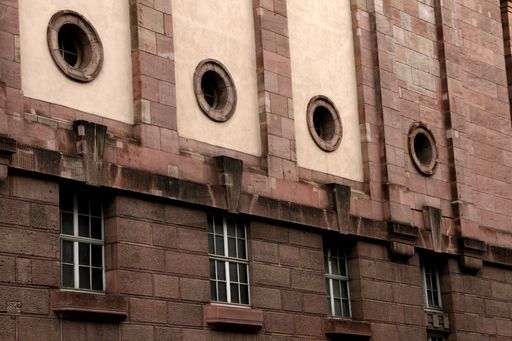 A closeup of an old stone building with barred windows in Nuremberg, Germany