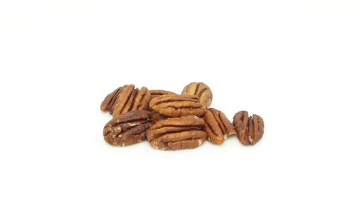A closeup shot of some pecans isolated on a white background